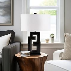 a living room scene with focus on the table lamp