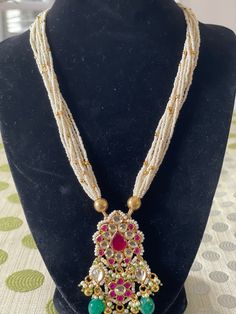 Premium quality Medium length Pachi Kundan haram with earrings. Lightweight and silicone-based. Elegant Kundan Necklace With Pearl Chain For Puja, Fusion Style Kundan Necklace With Latkans, Fusion Kundan Necklace With Latkans, White Kundan Fusion Necklace, Elegant Kundan Pearl Necklace For Puja, White Fusion Style Kundan Necklace, White Chandbali Kundan Necklace In Fusion Style, Heavy Fusion Kundan Necklace For Festivals, Festive Fusion Kundan Necklace With Latkans