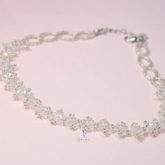 This white crystal bead choker is perfect for cocktail party outfit, wedding party, features shiny white bead with adjustable chain. Add this white rhinestone choker to your everyday fashion jewelry collection or as gift for your love one. Choker length: 13 +2 inches Materials: beads Jewelry Care: See more information about how to care for your jewelry here. Shipping Policy: Orders will be shipped within 1-3 business days. Economy shipping will take 7-14 days to arrive and standard shipping is 1 Crystal Clavicle Chain Choker For Party, White Crystal Necklace With Clavicle Chain For Party, Party Crystal Choker With Clavicle Chain, White Rhinestone Clavicle Chain Necklace For Party, White Rhinestone Clavicle Necklace For Party, Beaded Choker Bridal Necklace For Party, Clavicle Chain Crystal Choker Necklace For Weddings, Adjustable Rhinestone Choker For Formal Occasions, Wedding Crystal Choker Necklace With Clavicle Chain