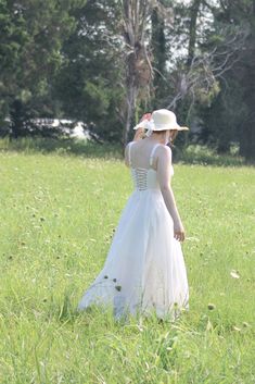 A must-have dress for spring and summertime, the Meadowlark midi features a vintage-style boned bodice with open, lace-up corset back, adjustable shoulder straps, a flowy tea-length skirt, and romantic sweetheart bustier neckline. A note on sizing- while this dress has an adjustable bust size due to the corset-style back, the waist is a single measurement and has no stretch, please choose your size accordingly! . Details: S: Bust: 32"-36", Waist 26" M: Bust 34"-38", Waist 28" L: Bust 36"-40", Wa Spring A-line Corset Dress With Corset Back, Spring A-line Corset Dress With Fitted Bodice, Summer A-line Corset Dress For Prom, Summer A-line Corset Dress With Adjustable Straps, Elegant Dress With Adjustable Straps And Underbust Design, Elegant Underbust Dress With Adjustable Straps, Lace Midi Dress For Prom In Summer, A-line Corset Dress With Lace-up Back, Summer Underbust Dress With Corset Back