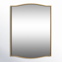 a mirror hanging on the wall with a gold frame and an empty space for text