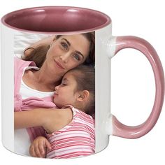 a woman holding a child in her arms on a pink and white coffee mug with the image of a mother's love