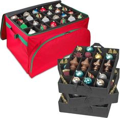 two red boxes filled with assorted christmas ornaments