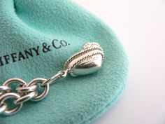 Overview:Offered for sale is a wonderful and gorgeous Tiffany & Co. Sterling Silver 3 Heart Arrow Charm Dangle bracelet. Definitely a Tiffany piece that you will get your money's value for. It works perfectly with pretty much any attire your put on, AND is an awesome statement piece. Very pretty and unique piece - the piece has 3 gorgeous Heart / Arrow charms dangling on it! It is the perfect bracelet that fits a lifestyle on the go -- the piece can be worn to pretty much any occasion! It is Unique Pies, Dangle Bracelet, 3 Hearts, Heart With Arrow, Bracelet Bangle, Tiffany Heart, Heart Charm Bracelet, Tiffany & Co., Solid 925 Sterling Silver