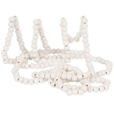 white beads are arranged in the shape of letters