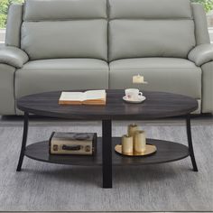 a living room with a couch, table and coffee table