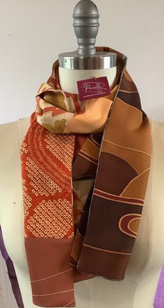 This unique double sided scarf is handmade using vintage Japanese silk kimono and silk offcuts.   The colours and patterns are just stunning. The autumn colours are rich and warm. Every one of my scarves is unique and I take time to select each piece of silk to complement each other.  You will receive lots of admiring comments when you wear this beautiful scarf! Traditional Brown Silk Scarf, Bohemian Brown Silk Scarves, Brown Bohemian Silk Scarves, Bohemian Brown Silk Scarf, Vintage Silk Rectangular Scarf, Traditional Brown Silk Scarves, Brown Silk Scarves For Fall, Fall Multicolor Silk Scarf, Bohemian Rectangular Silk Scarf