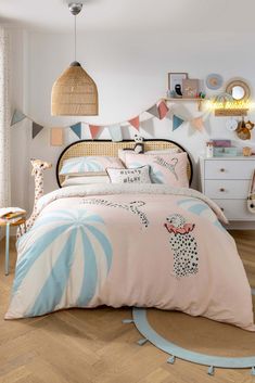 a bed room with a neatly made bed and lots of decorations on the headboard