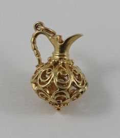 "This is a vintage \"Reticulated Jug\" 14 karat gold charm for a charm bracelet. It weighs 3.75 grams and measures 5/8\" x 7/8\", marked \"14K\" All charms come with a split ring to attach to a bracelet. We have hundreds of charms in stock. If you don't see what you are looking for in our shop please contact us as it is likely we have it. Inventory #G3218" Split Rings, Small Rings, Split Ring, Gold Charm, 10k Gold, Vintage Charms, Heart Charm, Arm Band, Gold Filled