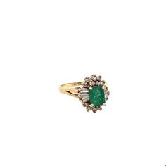 Ring Details: ✔ Gold Karat: 14K ✔ Ring Size: 7 ✔ Ring Weight: 3.9 grams ✔ Mounting: Prong ✔ Shank: Cathedral ✔ Diamonds: (6 baguette-cut diamonds, 0.24ctw) (14 round cut diamonds, 0.19ctw)  Emerald Details: ✔ Carat: 1.00 ✔ Cut: Emerald ✔ Origin: Colombia ✔ Color: Green (deep) ✔ Clarity: Very good ✔ Luster: Excellent Vintage natural Emerald and natural diamond ring in 14k solid yellow gold. This vibrant Emerald bears excellent color and luster. It's well contrasted by a round and baguette-cut dia Yellow Gold Emerald Cut Multi-stone Ring, Heirloom Yellow Gold Baguette Cut Cluster Ring, Formal Yellow Gold Baguette Cut Cluster Ring, Oval Gold Rings With Baguette Diamonds, Classic Multi-stone Baguette Cut Diamond Ring, Formal 14k Gold Baguette Cut Emerald Ring, Classic Multi-stone Baguette Cut Rings, Formal Baguette Cut Emerald Ring In 14k Gold, Oval Yellow Gold Ring With Baguette Diamonds