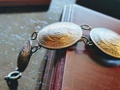 "Men's Silver Concho Bracelet Antique Peruvian 1870-1912 Peru Peruvian Dinero Sol .900 Silver Coin 8\" Silver Bracelet. 23mm wide. Adjustable by adding or removing the sterling silver split rings as shown. The coins that were used to Make This handsome antique men's Concho bracelet were Minted in Peru from 1879 until 1912. The Bracelet has a total weight of 30.5 grams. This is an all-original, antique Peruvian silver 23mm authentic Peru 1/5 Sol coin Concho bracelet Bracelet. Coin bracelet has be Victorian Brass Silver Bracelets, Collectible Historical Jewelry With Antique Finish, Collectible Antique Finish Historical Jewelry, Victorian Engraved Bracelets Collectible, Victorian Engraved Bracelet, Victorian Engraved Collectible Bracelet, Antique Stamped Bracelets For Formal Occasions, Antique Silver Nickel-free Bracelets, Vintage Medallion Bracelet For Gift