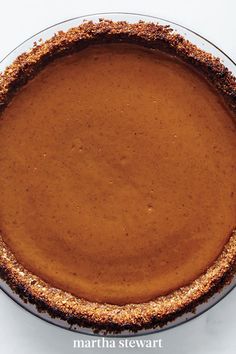 a chocolate pie sitting on top of a white table