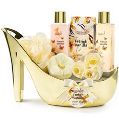 The Elegant French Vanilla Bath Set, presented in a stunning gold high heel shoe, offers a luxurious escape into relaxation and style. This spa gift set features a creamy French vanilla shower gel that gently cleanses, rich body lotion for deep hydration, and calming bath salts that transform your bath into a soothing retreat. The set also includes a decorative soap flower, adding a touch of elegance to any bathroom. Perfect for gifting or personal indulgence, it combines chic design with pamper Lavender Hand Soap, Bath And Body Gift Set, Best White Elephant Gifts, Gift Baskets For Women, Gold High Heels, Decorative Soaps, Spa Set, Bath Set, Spa Gifts Set