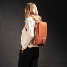 Lightweight, compact, functional and refined, the Chiara backpack will become your everyday ally.

Made from high-quality full-grain leather, this backpack offers both durability and minimalist aesthetics. The combination of smooth and grained leather creates a subtle contrast that adds an extra touch of sophistication.

Its compact size shouldn't detract from its practicality, with plenty of storage space for all your daily essentials: laptop or tablet, cables, charger, battery, smartphone, A4 Computer Backpack, Daily Essentials, Personalized Accessories, Leather Working, Full Grain Leather, Smooth Leather, Storage Space, Leather Backpack, Cognac