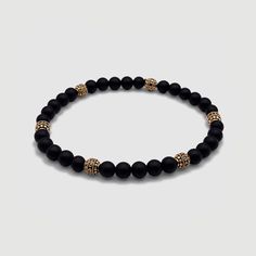 Effortless style is good manners. CRAFTD for individuality, every semi-precious Onyx stone displays its own unique markings, resulting in a truly one-of-a-kind piece. Enhanced with 18K gold beads, its relaxed aesthetic becomes the ideal companion for those essential laid-back days. Qualities: Sharpened Focus ✓ Semi-Precious Onyx Stone✓ 18K Gold & 316L Stainless Steel ✓ Water, Heat, Sweat Resistant Model is 5'11 & Wears Size 19cm. Luxury Beaded Onyx Jewelry, Luxury Onyx Beaded Jewelry, Luxury Hand-strung Round Bracelet, Modern Bracelets With Natural Stones, Elegant Agate Beaded Bracelets For Gift, Modern Adjustable Jewelry With 8mm Beads, Luxury Adjustable Gemstone Beaded Bracelets, Modern Natural Stone Round Bracelets, Adjustable Gold Onyx Bracelet