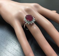 6.65 Carats Impressive Red Ruby and Diamond 14K White Gold Ring Suggested Replacement Value $4,800.00 Total Red Ruby Weight is: Approx. 6.00 Carats (lead glass filled) Ruby Measures: 11 x 9mm Natural Round Diamonds Weight: Approx. 0.65 Carats (color G-H / Clarity SI1-SI2) Ring total weight: 5.8 grams Disclaimer: all weights, measurements and colors are approximate and may vary slightly from the listed dimensions or as seen in the image. All pictures are magnified to show the smallest of details. Luxury Red Diamond Ring With Vvs Clarity, Elegant Ruby Ring With Diamond For Party, Fine Jewelry Ruby Ring With Diamond For Party, Party Fine Jewelry Ruby Ring With Diamond, Ruby Party Ring, Luxury Red Ruby Ring With Vvs Clarity, Luxury Red Cluster Diamond Ring, Formal Red Gemstone Brilliant Cut Diamond Ring, Gia Certified Red Diamond Ring For Formal Occasions