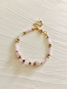 Madagascar rose quartz bracelet.  Beautiful elegant bracelet consists of high quality faceted natural rose quartz and 18 k. gold filled beads.  Rose quartz is love stone- self love, joy, inner peace, connection matters of the heart. Bracelet is assembled on a very durable jewelry wire. Length is adjustable 6.3 inches +2 in. extension chain. Nickel free stainless steel lobster clasp This bracelet is perfect to wear on its own, but also will be great layered combinations. Great gift idea for women Rose Quartz Bracelet Gemstones, Fine Bracelet, Bracelet Love, Gold Armband, Rose Quartz Bracelet, Dainty Bracelet, Rose Quartz Beads, Natural Stone Bracelets, Bracelet Gemstone