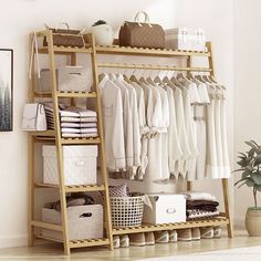 a wooden shelf filled with clothes and baskets