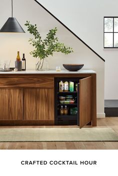 a wooden cabinet with an open door and shelves