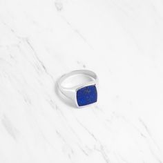 Experience the perfect blend of timeless sophistication and contemporary allure with our Ray Lapis Lazuli Large Square Signet Ring. This striking ring is meticulously crafted to make a bold statement, featuring a captivating lapis lazuli gemstone at its centre, radiating with deep, celestial blue hues. Details Stone: Lapis Lazuli Material: Sterling Silver 925 and Gold Vermeil If you would like to wear this ring as a wedding band, we can make it in solid gold. For inquiries or quotations, please Modern Jewelry With Vs Clarity Round Band, Modern Jewelry With Si Clarity Round Cut, Modern Jewelry With Polished Round Band, Modern Rings With Timeless Round Cut Design, Luxury Sterling Silver Signet Ring With Round Cut, Modern Sterling Silver Promise Ring, Modern Jewelry With Timeless Design For Anniversary, Modern White Gold Rings With Timeless Design, Modern Timeless Jewelry For Anniversary