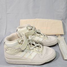 New, Never Worn (No Box) *See Pictures. Adidas X Ivy Park Forum Mid 'Icy Park Cream White' High Top Sneakers. Size: 5 Women’s Comes With Dust Bag & Strap Style: Gw2857 Colorway: Alumin/Cream White/Gum * Smoke-Free Home Thank You For Looking Let Me Know If You Have Any Questions. Check Out My Other Items Adidas High Shoes, High-top Sneakers With Laces And Medium Fit, Medium Fit High-top Sneakers With Laces, Cream High-top Lace-up Sneakers With Boost Midsole, Cream Sporty Basketball Shoes For Streetwear, Cream Basketball Shoes For Streetwear With Round Toe, Cream High-top Basketball Shoes For Streetwear, Cream High-top Sneakers With Laces, Cream Basketball Shoes For Streetwear