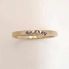 Yellow Gold Filled Cursive Name Ring Yellow Gold Filled Stacking Ring, cursive name ring, cursive font name ring, Stacking Ring, Stacked Rings, Stacking Name Rings, Gold Filled Stacking Name Ring, Yellow Gold Filled Stacking Name Rings, Mom Gift, Gift for New Mom, Mother's Day Gift, Christmas Gift for mom, Christmas Gift for Wife, Personalized Mom Gift, Personalized Wife Gift Mother's Day Gifts, Mom Rings, Yellow Gold Filled Name Rings, Set of Rings, Mother Rings These rings are handmade in our Adjustable Stackable Promise Rings With Custom Name, Minimalist Custom Name Engraved Ring For Promise, Minimalist Initial Ring With Engraving For Promise, Minimalist Personalized Engraved Promise Ring, Meaningful Hand Stamped Engraved Promise Ring, Personalized Dainty Gold Engraved Ring, Meaningful Anniversary Rings With Engraving Option, Customizable Minimalist Engraved Promise Ring, Minimalist Hand Stamped Engraved Ring For Anniversary