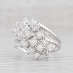 Gemstone Information: - Natural Diamonds - Total Carats - 1.70ctw Cut - Round Brilliant Color - G - I Clarity - I2 - I3 Please note there are surface reaching inclusions.  Metal: 14k White Gold Weight: 6.6 Grams  Stamps: 14k Face Height: 19.2 mm  Rise Above Finger: 12.6 mm Band / Shank Width: 3 mm This ring is a size 6 1/2, but it can be resized down 1 size for a $20 fee or up 2 sizes for a $30 fee. If you would like your ring resized, please select the appropriate fee from the listing below in order to pay the sizing fee: https://www.etsy.com/listing/781388346/ring-sizing-service-fee Each piece is thoroughly examined and refinished as needed by our professional jewelers, graded by our in-house GIA (Gemological Institute of America) Graduate Gemologist, and inspected for quality before bei Mens Custom Jewelry, Cocktail Jewelry, Silver Flatware, Rise Above, Ring Pictures, Cluster Ring, Estate Jewelry, Round Brilliant, Custom Jewelry