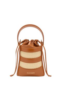 "Find ALEXANDER MCQUEEN The Rise Mini Bucket Bag on Editorialist. Alexander McQueen \"The Rise\" bucket bag in nylon, leather, and cotton Top handle Detachable chain crossbody strap Can be worn as a top handle or crossbody bag Drawstring closure Approx. 6.3\"H x 8.3\"W x 2.3\"D Made in Italy" Luxury Leather Summer Bucket Bag, Luxury Leather Bucket Bag For Summer, Leather Bucket Bag With Bamboo Handle For Shopping, Designer Natural Bucket Shoulder Bag, Designer Natural Color Bucket Shoulder Bag, Designer Natural Color Shoulder Bucket Bag, Leather Bucket Bag With Bamboo Handle In Natural Color, Leather Bucket Bag With Bamboo Handle For Daily Use, Natural Leather Bucket Bag With Bamboo Handle