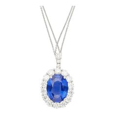 GRS Certified 5.83 Carat Oval Cut No Heat Sri Lanka Origin Blue Sapphire and Round Cut Diamond Halo Platinum Pendant Necklace.  Item Details: Item Type: Pendant Necklace Metal Type: Platinum 900 Weight 5.59 Grams Closure: Spring Ring   Center Stone Details: Type: Sri-Lanka Sapphire Carats: 5.83  Cut: Oval Setting: 4-Prong Certification: GRS  Side Stone Details: Type: Natural Diamonds Carat: 2.10 Total Cut: Round Quantity: 17 Setting: Prong Halo  This elegant platinum pendant necklace features a stunning 5.83 carat oval-cut no-heat Sri Lanka sapphire, certified by GRS, and set in a secure 4-prong design. Surrounded by a halo of 17 natural round-cut diamonds, totaling 2.10 carats, this piece radiates luxury and timeless beauty. Weighing 5.59 grams, this pendant is perfect for those who appre Chanel Pendant, Pink Pendant Necklace, Purple Pendant Necklace, Platinum Pendant, Art Deco Pendant Necklace, Black Pendant Necklace, Blue Pendant Necklace, Oval Setting, Ruby Necklace Pendant