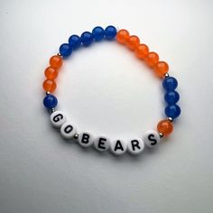 Chicago Bears Bracelet.  Bear Down. Please note size:  5 - 5.5 inches small (kids)  6.5 standard  7.5-8.5 large/ men's sizes Personalized Blue Charm Bracelet With Round Beads, Blue Charm Bracelet With Letter Beads, Blue Charm Bracelet With Letter And Round Beads, Blue Name Bracelet With Colorful Beads As Gift, Personalized Blue Wristband With Round Beads, Casual Blue Charm Bracelet With Round Beads, Adjustable Blue Name Bracelet With Colorful Beads, Blue Name Bracelet With Colorful Round Beads, Blue Name Bracelet With Colorful Beads