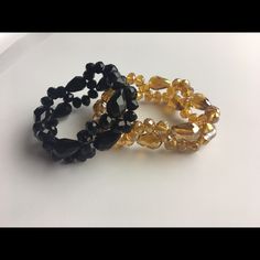 Stretch Bracelets In Light Golden And Black. Never Worn. Elegant Adjustable Black Beads Stretch Bracelet, Elegant Black Bead Stretch Bracelet For Parties, Elegant Black Beads Stretch Bracelet, Elegant Black Beaded Stretch Bracelet For Party, Trendy Adjustable Black Crystal Bracelet, Black Beaded Bangle Bracelets For Party, Black Round Beads Bracelets For Party, Black Crystal Bracelet With Round Beads For Party, Trendy Black Stretch Bracelet For Party