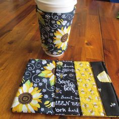 a coffee cup sleeve with sunflowers on it