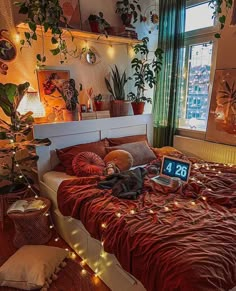 a bed room with a neatly made bed and lots of plants