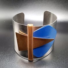 Vintage MONET Modernist, Geometric, Copper, Silver Tone, Blue,  Wide Cuff Bracelet, Stunning Piece Modern Multicolor Cuff Bangle Bracelet, Modern Multicolor Bangle Cuff Bracelet, Modern Adjustable Multicolor Cuff Bracelet, Blue Cuff Bracelet Bangle For Formal Occasions, Unique Blue Bangle Cuff Bracelet, Blue Bangle Cuff Bracelet For Formal Occasions, Formal Blue Bangle Cuff Bracelet, Contemporary Adjustable Metal Cuff Bracelet, Adjustable Metal Contemporary Cuff Bracelet