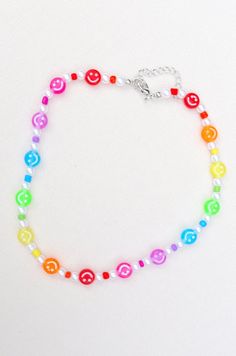 a multicolored beaded bracelet with smiley faces on the front and back side