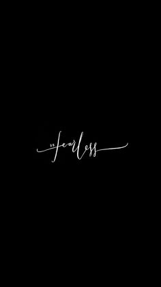 the word fearless written in cursive writing on a black background with white ink