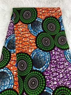 an orange, purple and green african print skirt