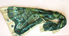 Green Silk Scarf hand painted. Mothers Day gift. Woman fashion wrap in green and aqua colours combo. Handpainted scarves. Art Deco shawl painted. Long Luxurious shawls. Unique handmade scarves. Silk painting, Evening shawl wrap. Garden Wedding accessory. Wedding accessory. Romantic wedding style. Botanical scarf. Olive green silk scarf with turquoise flowers painted in stylized composition. ♥This is a unique, hand painted silk scarf measuring 35 by 70 inches. Silk scarf painted on pure silk 6mm, Handmade Bohemian Green Silk Scarf, Handmade Green Bohemian Silk Scarf, Elegant Handmade Green Silk Scarf, Hand Painted Green Silk Scarf, Green Bohemian Silk Scarf For Gift, Green Bohemian Silk Scarf As Gift, Bohemian Green Silk Scarf As Gift, Green Handmade Shawl As Gift, Handmade Green Shawl For Gift