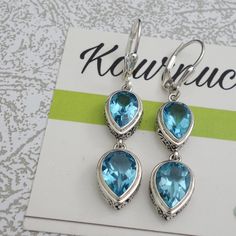 Swiss Blue Topaz Beautiful Earrings. Nice size Stones. Lovely Ornate handwork on bezel Length 1.70 inch Stone Size 10x7mm 9x6mm Turquoise Blue Topaz Jewelry Set With Matching Earrings, Blue Topaz Earrings With Gemstone Accents, Blue Topaz Gemstone Earrings, Blue Topaz Gemstone Earrings For Anniversary, Topaz Anniversary Earrings With Gemstone Accents, Anniversary Blue Topaz Gemstone Earrings, Nickel Free Blue Topaz Drop Earrings, Nickel-free Blue Topaz Dangle Earrings, Blue Topaz Dangle Earrings Fine Jewelry