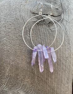 Raw purple quartz crystal points in gold or silver hoop earrings with French hooks. Perfect little boho look. Light weight and easy to wear. Add these to your boho outfits and make a 💜Healing clear quartz Crystal property has been know for centuries to restore balance in the body. -Options- 30mm as shown 21 gauge hoops Total drop Length: 2.3 inches 14k Gold filled hoops Sterling silver hoops Gold plated hoops Silver plated hoops All comes with hooks Simple, Dainty, Delicate, yet so Elegant and Purple Hoop Jewelry For Gift, Spiritual Hoop Earrings With Ear Wire, Handmade Minimalist Dangle Crystal Earrings, Handmade Minimalist Crystal Dangle Earrings, Purple Amethyst Hoop Jewelry, Unique Hoop Earrings With Natural Stones, Everyday Purple Jewelry With Ear Wire, Adjustable Hoop Earrings With Spiritual Style, Adjustable Gemstone Hoop Jewelry