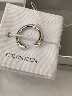 Calvin Klein Brilliant This Calvin Klein ring is very gorgeous on the fingers.    The clear stone makes it stand out. Calvin Klein embossed on the ring. Open ended ring.  Comes with box and pouch. Modern Open Ring Jewelry With Vs Clarity, Modern Crystal Open Ring With Vs Clarity, Luxury Crystal Open Ring, Luxury Open Crystal Ring, Modern Open Ring With Vs Clarity, Calvin Klein Accessories, Modern White Gold Crystal Ring For Gift, Amethyst Open Ring For Anniversary, Modern Jewelry Gifts With Vs Clarity