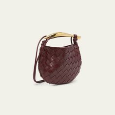 Bottega Veneta top handle bag in  intrecciato  lambskin leather Knotted thing crossbody strap  Metal top handle  Open top with magnetic closure  Approx. 4.7"T x 7.9"W x 0.9"D Made in Italy Luxury Top Handle Shoulder Bag For Errands, Luxury Hobo Shoulder Bag For Errands, Luxury Shoulder Bag For Errands, High-end Crossbody Shoulder Bag For Errands, Luxury Shoulder Bucket Bag For Errands, Luxury Double Handle Baguette Bag For Shopping, High-end Top Handle Baguette Bag With Removable Pouch, Luxury Baguette Tote Bag With Detachable Handle, High-end Shoulder Bag With Gold-tone Hardware