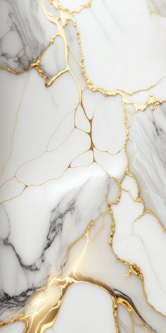 white and gold marble wallpaper with golden lines in the center, on top of it