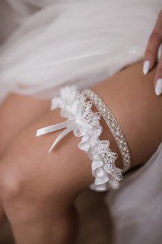 Handmade bridal garters set of two: 1. Bridal garter of crystal beaded embroidery and pearls (ca. 1 cm width) 2. Wedding garter made of delicate Italian lace with a satin bow (ca. 4 cm width) One can buy them separately. Please, check the right choice. Elevate your bridal ensemble with our enchanting crystal bridal garter set, a personalized touch to your wedding attire that exudes elegance and charm. 📏 Size Options: Refer to our size chart below to ensure the perfect fit: Medium (M): Circumference above the knee: 15-17.3 in (38-44 cm) Large (L): Circumference above the knee: 17.3-19.7 in (44-50 cm) All wedding garters are made with special elastic bands for convenient adjustment around the leg.  We also make customized garters to individual orders. To do this, please provide us with meas Wedding Thigh Garter, Garter For Bride, Boho Wedding Garter, Plum Wedding Colors, Wedding Garder, Garter Set Wedding, Thigh Garter, Bride Garter, Wedding Accessories For Bride