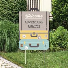 a welcome sign for an adventure awaits in front of some bushes and shrubs on the sidewalk