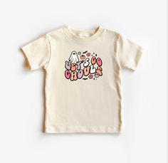 Retro Trendy Let's Go Ghouls Halloween Toddler T-shirt. Retro Trendy Let's Go Ghouls Halloween Toddler Shirt. Super cute and trendy Halloween outfit for newborns, infants, and toddlers. Buttery-soft cotton. Unisex design can be dressed up or down. Perfect for fall, pumpkin patch, and Halloween pictures. Let's Go Ghouls Halloween Toddler T-shirt sizes are available in: 12M, 18M, 2T, 3T, 4T, 5T Let's Go Ghouls Halloween Onesie® sizes are available in: newborn, 0-3M, 3-6M, 6-9M, 12M, 18M, 24M Large Toddler Thanksgiving Shirt, Halloween Shirts For Toddlers, Nutcracker Shirt, Retro Halloween T-shirt Pre-shrunk, Halloween Toddler Shirt, Halloween Yellow Graphic Print T-shirt, Retro Halloween T-shirt With Character Print, Trendy Christmas Outfits, Baby Announcement Shirts