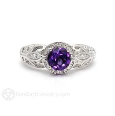 "An absolutely gorgeous vintage inspired Amethyst ring ring in your choice of 14K or 18K White, Yellow or Rose Gold and Platinum. This ring has a .75ct natural Amethyst surrounded by a sparkling diamond halo and diamonds in the leaves of the gorgeous filigree band. It's a beautiful right hand ring or engagement ring. Inquire for the matching wedding band. Amethyst is the birthstone for February. Made to order. Please allow three to four weeks for delivery. ABOUT THIS RING Composition: 14K or 18K Heirloom Purple Sapphire Ring For Anniversary, Heirloom Amethyst Ring With Accent Stones, Heirloom Amethyst Ring With Center Stone, Exquisite Amethyst Ring For Anniversary, Heirloom Purple Ring With Center Stone, Heirloom Purple Amethyst Ring With Center Stone, Heirloom Purple Rings With Accent Stones, Heirloom Amethyst Rings With Accent Stones, Heirloom Purple Diamond Ring