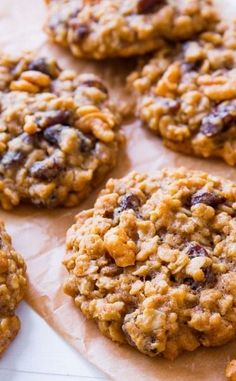 oatmeal cookies with raisins and chocolate chips arranged on parchment paper