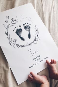 a baby's hand and foot prints on a paper