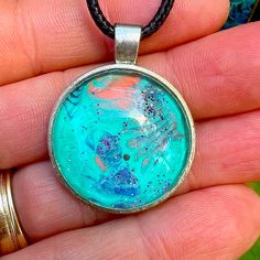 Fluid Art Necklace, Black Wax Chord. One Of A Kind Adjustable Turquoise Necklace For Gift, Adjustable Turquoise Necklace As A Gift, Adjustable Light Blue Turquoise Necklace Gift, Blue Hand Painted Round Pendant Necklace, Artistic Blue Jewelry For Festivals, Artsy Turquoise Nickel-free Jewelry, Artistic Turquoise Necklace With Large Pendant, Hand Painted Blue Round Pendant Necklace, Handmade Turquoise Blue Round Pendant Necklace